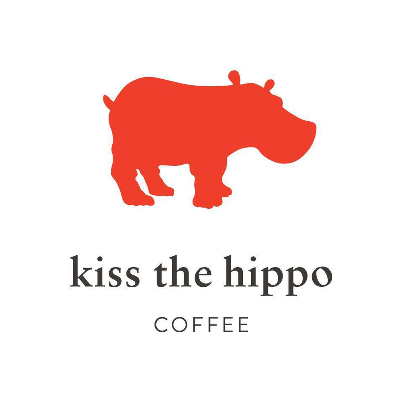 Red hippo graphic above 'kiss the hippo coffee' text on white background, coffee logo