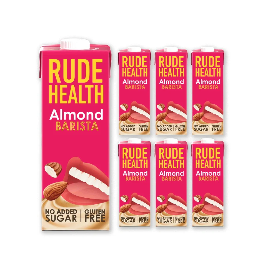 Multiple boxes of Rude Health Almond Barista on a white background
