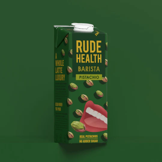 Green carton of Rude Health Pistachio milk on a green background