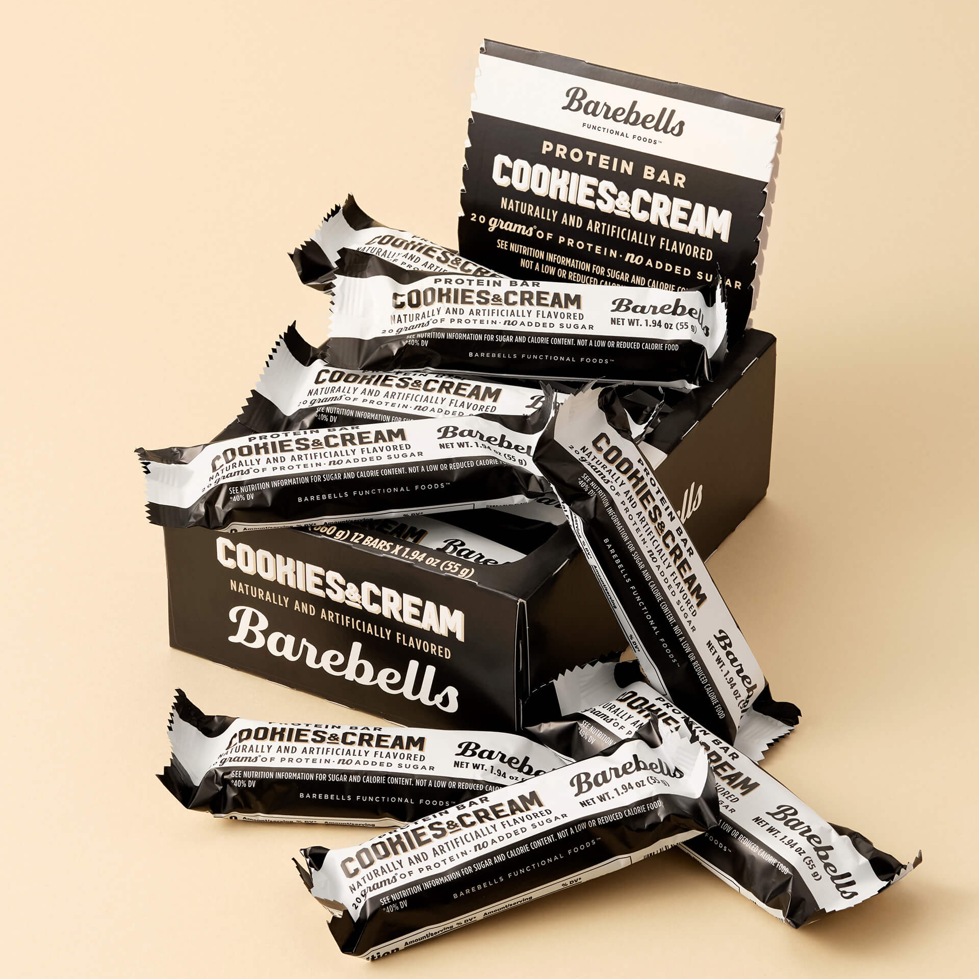 Barebells Cookies & Cream protein bars on a beige background